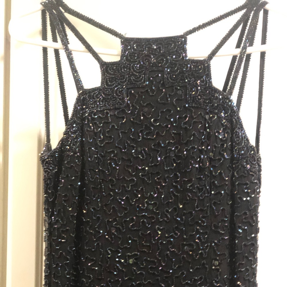 Long fully beaded black formal.